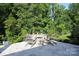 Outdoor patio area with stone pavers, and lush green landscape at 914 Greenbridge Dr, Matthews, NC 28105
