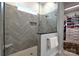 Walk-in shower with glass enclosure, gray tile, and a built-in niche at 914 Greenbridge Dr, Matthews, NC 28105