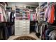 Spacious walk-in closet with built-in shelves, drawers, and ample hanging space for organized storage at 914 Greenbridge Dr, Matthews, NC 28105