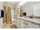 Well lit bathroom with a double vanity and a shower and tub combination at 9330 Carneros Creek Rd, Charlotte, NC 28214