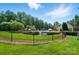 View of the fenced community pool and clubhouse at 9330 Carneros Creek Rd, Charlotte, NC 28214