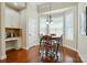 Cozy dining area with natural light and views from many windows and stylish furnishings at 9330 Carneros Creek Rd, Charlotte, NC 28214