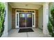 Inviting front entrance featuring a stylish double door, stone accents, and a welcoming porch area at 9330 Carneros Creek Rd, Charlotte, NC 28214