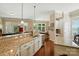 Open kitchen with granite countertops, stainless steel appliances, and a view of the dining area at 9330 Carneros Creek Rd, Charlotte, NC 28214