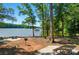 Lakeside with picnic tables, grilling area, and adirondack chairs at 9330 Carneros Creek Rd, Charlotte, NC 28214
