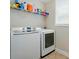 Neat laundry room complete with a side by side washer and dryer at 9330 Carneros Creek Rd, Charlotte, NC 28214