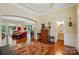 Open-concept living area with hardwood floors, elegant trim, and ample space for entertaining and relaxing at 9330 Carneros Creek Rd, Charlotte, NC 28214