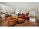 Spacious living room with an open floor plan, hardwood flooring, and an inviting atmosphere at 9330 Carneros Creek Rd, Charlotte, NC 28214