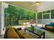 Beautiful screened-in patio with comfortable seating and an outdoor kitchen at 9330 Carneros Creek Rd, Charlotte, NC 28214