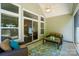 Inviting screened-in patio with comfortable seating and plenty of natural light at 9330 Carneros Creek Rd, Charlotte, NC 28214