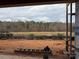 Backyard during construction, showing an open space with a distant view of bare trees and an overcast sky at 9662 Liberty Hill Dr, Mint Hill, NC 28227