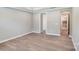 Bright bedroom featuring hardwood floors and neutral paint palette at 9662 Liberty Hill Dr, Mint Hill, NC 28227