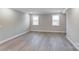 Empty room with neutral walls, flooring, and two windows, ready to be personalized at 9662 Liberty Hill Dr, Mint Hill, NC 28227