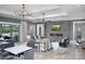 An open-concept living room with plenty of natural light, a fireplace and views of the outdoors at 9662 Liberty Hill Dr, Mint Hill, NC 28227