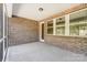 Covered brick patio perfect for outdoor dining or relaxation at 9662 Liberty Hill Dr, Mint Hill, NC 28227