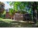Charming backyard featuring a deck and screened porch for outdoor relaxation at 10408 Hadleigh Pl, Charlotte, NC 28210