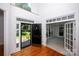 Inviting foyer with hardwood floors, an open floor plan and natural light at 10408 Hadleigh Pl, Charlotte, NC 28210