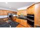 Large kitchen has granite counters, stainless appliances, double oven, and wood cabinets at 10408 Hadleigh Pl, Charlotte, NC 28210