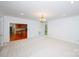 Open living room with neutral carpet and access to the kitchen at 10408 Hadleigh Pl, Charlotte, NC 28210