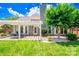 Beautiful backyard features a pergola-covered patio and manicured landscaping at 10418 Pullengreen Dr, Charlotte, NC 28277