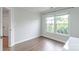 Hardwood bedroom with a desk, a large window and natural light at 10418 Pullengreen Dr, Charlotte, NC 28277