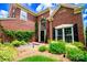 Welcoming brick home featuring a bright front entrance and a beautifully landscaped front yard at 10418 Pullengreen Dr, Charlotte, NC 28277