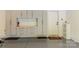 Garage with epoxy floor, storage cabinets and shelves at 10418 Pullengreen Dr, Charlotte, NC 28277