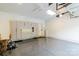 Spacious garage with cabinets, epoxy floor, and door to the exterior at 10418 Pullengreen Dr, Charlotte, NC 28277