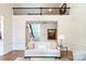 Elegant living room showcasing a sofa, wainscoting, and an open view to the upper level at 10418 Pullengreen Dr, Charlotte, NC 28277