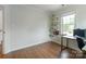 This office space features a modern desk, shelving and large window at 10418 Pullengreen Dr, Charlotte, NC 28277