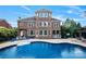 Expansive backyard with in-ground pool and patio seating, perfect for outdoor entertaining at 11335 Wescott Hill Dr, Huntersville, NC 28078