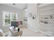 Bright bedroom has an adjacent office space with large windows, bookshelves, and a desk at 11335 Wescott Hill Dr, Huntersville, NC 28078