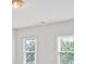 Bedroom with neutral walls and carpet has a window and ceiling light fixture at 11335 Wescott Hill Dr, Huntersville, NC 28078