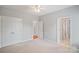 Bedroom with neutral carpet and walls features two closets and two doorways at 11335 Wescott Hill Dr, Huntersville, NC 28078