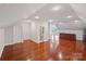 Bonus room with hardwood flooring, wet bar and adjoining half bath at 11335 Wescott Hill Dr, Huntersville, NC 28078