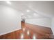 Light-filled bonus room featuring hardwood floors and recessed lighting at 11335 Wescott Hill Dr, Huntersville, NC 28078