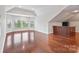 Spacious bonus room with hardwood flooring, a wet bar and large windows at 11335 Wescott Hill Dr, Huntersville, NC 28078