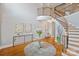 Spacious foyer with curved staircase and hardwood floors, offering a sophisticated entrance and ample natural light at 11335 Wescott Hill Dr, Huntersville, NC 28078
