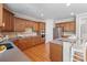Well-equipped kitchen with stainless steel appliances, wood cabinets, and an island with seating at 11335 Wescott Hill Dr, Huntersville, NC 28078