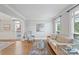 Bright and airy living room with hardwood floors, neutral décor, and large windows offering plenty of natural light at 11335 Wescott Hill Dr, Huntersville, NC 28078