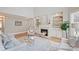 Bright living room with fireplace, built-in shelving, light-colored furniture, and a decorative rug at 11335 Wescott Hill Dr, Huntersville, NC 28078