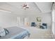 Spacious primary bedroom featuring tray ceilings, neutral decor, sitting area, and large windows at 11335 Wescott Hill Dr, Huntersville, NC 28078