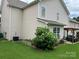 View of the home's backyard, showing a large lawn and patio area at 11511 Wilson Mill Ln, Pineville, NC 28134