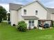 Spacious backyard featuring a lush green lawn and a charming pergola patio at 11511 Wilson Mill Ln, Pineville, NC 28134