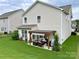 Backyard view showcasing a pergola-covered patio and well-maintained lawn at 11511 Wilson Mill Ln, Pineville, NC 28134