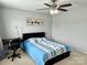 Cozy bedroom with a ceiling fan, large window, and neutral paint at 11511 Wilson Mill Ln, Pineville, NC 28134