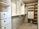 Spacious walk-in closet with custom shelving and drawers for organized storage at 11511 Wilson Mill Ln, Pineville, NC 28134