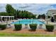 Community pool with lounge chairs, offering a refreshing oasis for relaxation at 11511 Wilson Mill Ln, Pineville, NC 28134
