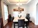 Elegant dining room with hardwood floors, tray ceiling and stylish decor at 11511 Wilson Mill Ln, Pineville, NC 28134