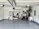 Organized garage space with storage shelves and a clean, epoxy-coated floor at 11511 Wilson Mill Ln, Pineville, NC 28134
